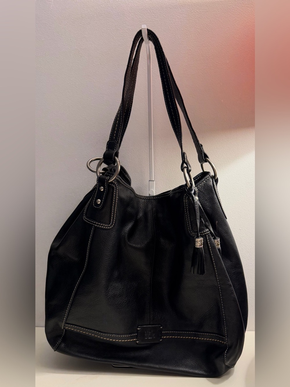 The Sak “PO Asbury” large pebbled black leather hobo/shoulder bag.